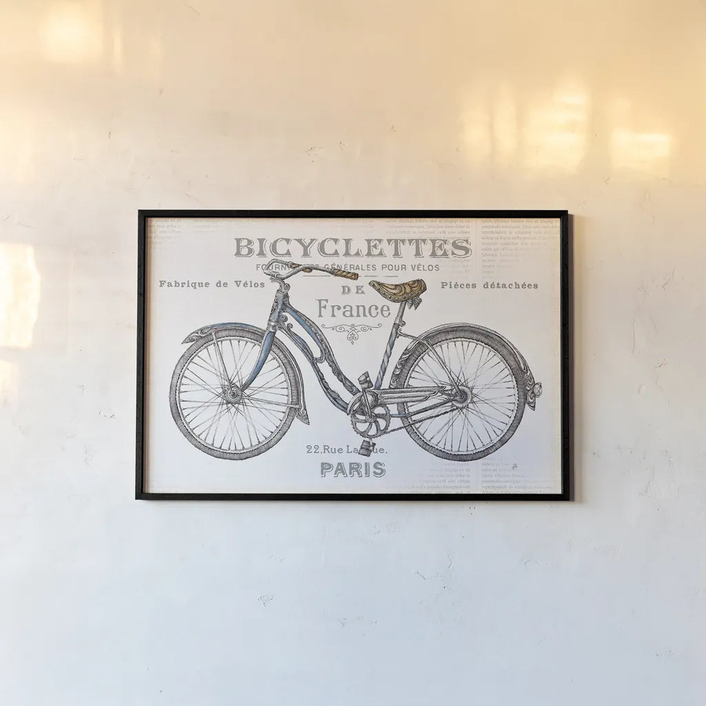 Bicycles II by Daphne Brissonnet. shown as a paper print in a black flame. Available as a archival giclee rolled canvas, fine art paper, or poster print. SKU 28774i.