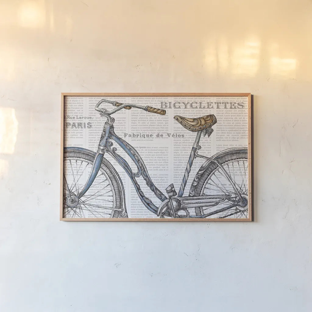 Bicycles IV by Daphne Brissonnet. shown as a paper print in a natural frame. Available as a archival giclee rolled canvas, fine art paper, or poster print. SKU 28776i.