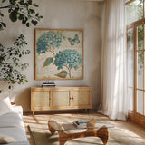 Blue Garden V by Daphne Brissonnet. Shown in a natural wood frame in a cozy modern living room. Available as an archival giclee rolled canvas, fine art paper, or poster print. SKU 25363a.