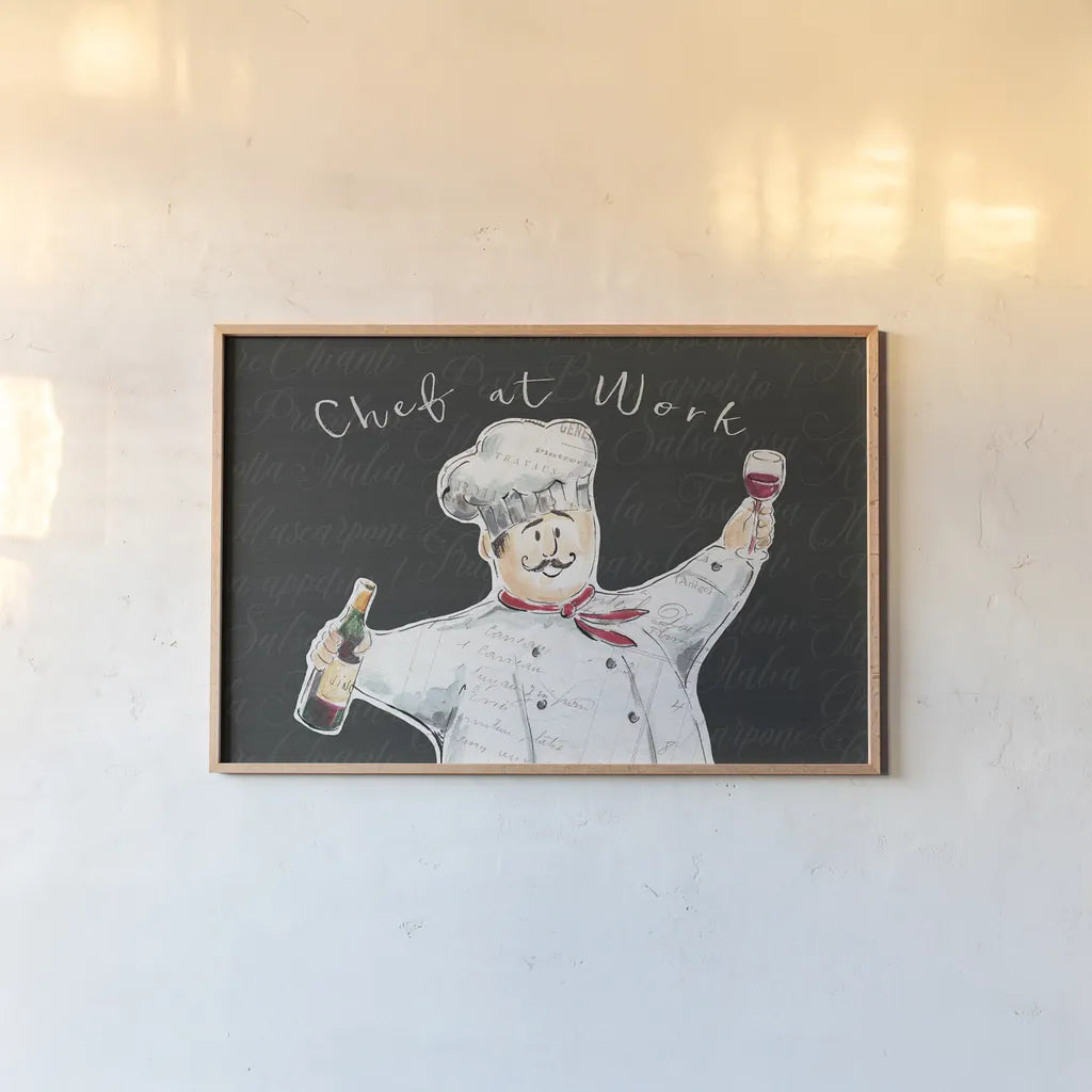 Chef at Work I by Daphne Brissonnet. shown as a paper print in a natural frame. Available as a archival giclee rolled canvas, fine art paper, or poster print. SKU 52667i.