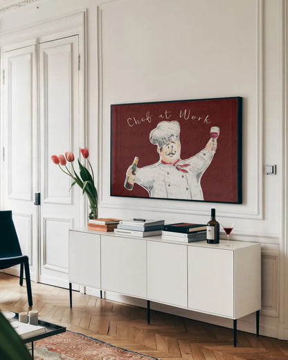 Chef at Work II by Daphne Brissonnet. shown as a framed stretched canvas in a living room above a console. Available as a archival giclee rolled canvas, fine art paper, or poster print. SKU 52668i.