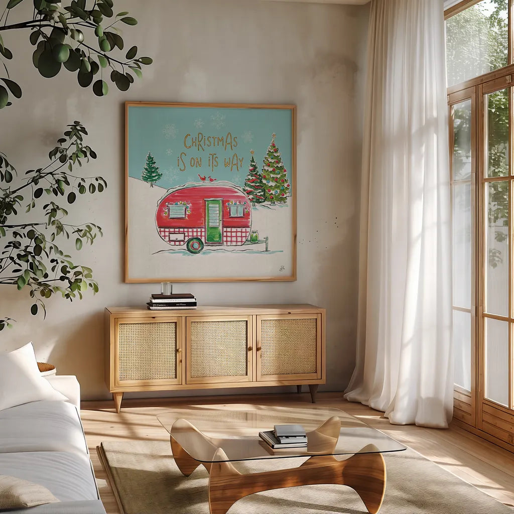 Christmas in the Country V On Its Way by Daphne Brissonnet. Shown in a natural wood frame in a cozy modern living room. Available as an archival giclee rolled canvas, fine art paper, or poster print. SKU 37384a.