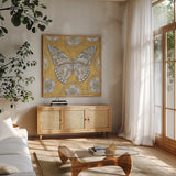 Color my World Butterfly I Gold by Daphne Brissonnet. Shown in a natural wood frame in a cozy modern living room. Available as an archival giclee rolled canvas, fine art paper, or poster print. SKU 28925a.