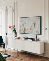 Desert Beauties I Aqua by Daphne Brissonnet. shown as a framed stretched canvas in a living room above a console. Available as a archival giclee rolled canvas, fine art paper, or poster print. SKU 65782i.