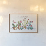Desert Bloom I by Daphne Brissonnet. shown as a paper print in a natural frame. Available as a archival giclee rolled canvas, fine art paper, or poster print. SKU 35017i.
