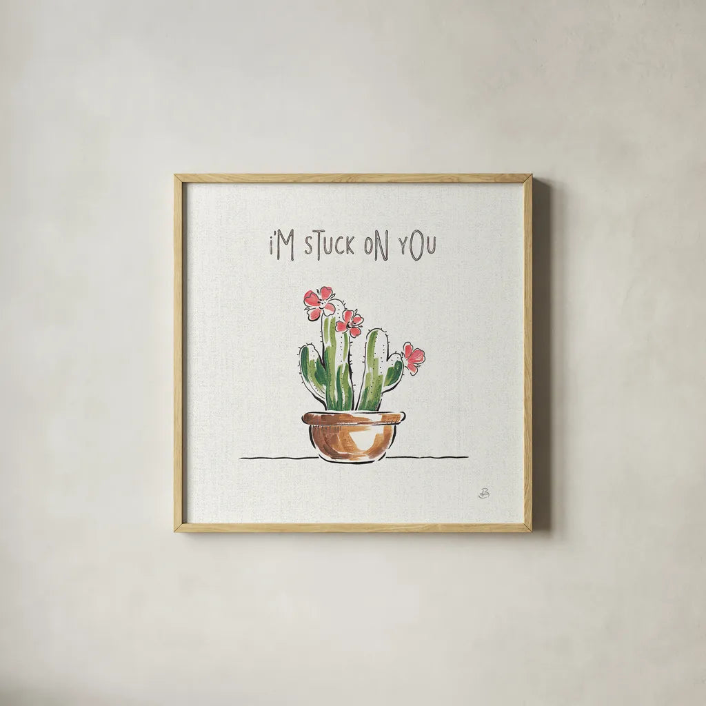 Desert Bloom II by Daphne Brissonnet. Shown in a natural wood glass frame for a timeless modern aesthetic. Available as an archival giclee rolled canvas, fine art paper, or poster print. SKU 35018a.