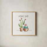 Desert Bloom III by Daphne Brissonnet. Shown in a natural wood glass frame for a timeless modern aesthetic. Available as an archival giclee rolled canvas, fine art paper, or poster print. SKU 35019a.