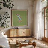Desert Bloom IX by Daphne Brissonnet. Shown in a natural wood frame in a cozy modern living room. Available as an archival giclee rolled canvas, fine art paper, or poster print. SKU 35025a.