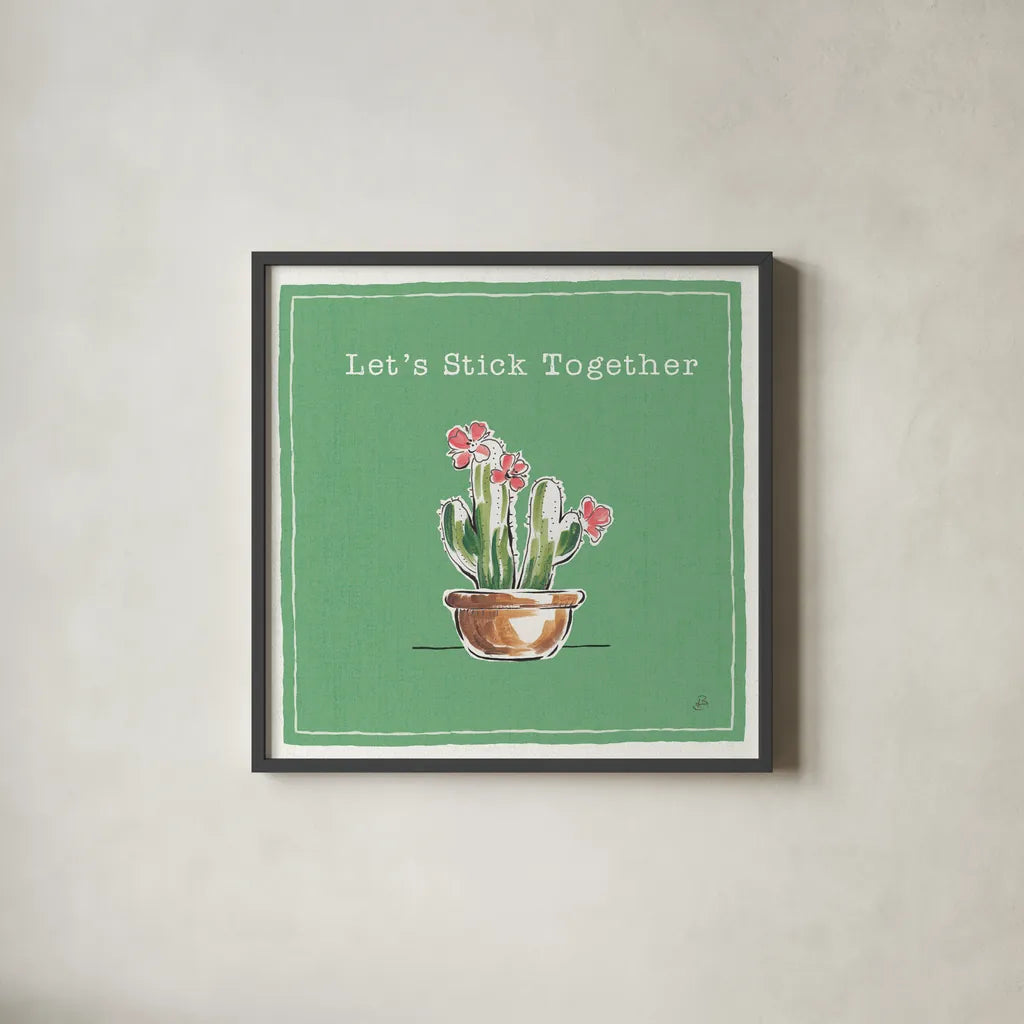 Desert Bloom X Together by Daphne Brissonnet. Shown in a sleek black glass frame for a contemporary gallery look. Available as an archival giclee rolled canvas, fine art paper, or poster print. SKU 42951a.