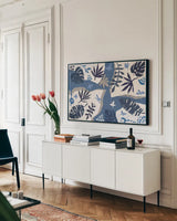 Desert Flair II by Daphne Brissonnet. shown as a framed stretched canvas in a living room above a console. Available as a archival giclee rolled canvas, fine art paper, or poster print. SKU 62045i.