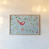 Holiday Wings I Blue by Daphne Brissonnet. shown as a paper print in a natural frame. Available as a archival giclee rolled canvas, fine art paper, or poster print. SKU 36747i.