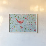 Holiday Wings I Blue by Daphne Brissonnet. shown as a paper print in a white frame. Available as a archival giclee rolled canvas, fine art paper, or poster print. SKU 36747i.