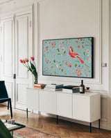 Holiday Wings II Blue by Daphne Brissonnet. shown as a framed stretched canvas in a living room above a console. Available as a archival giclee rolled canvas, fine art paper, or poster print. SKU 36748i.