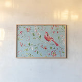 Holiday Wings II Blue by Daphne Brissonnet. shown as a paper print in a natural frame. Available as a archival giclee rolled canvas, fine art paper, or poster print. SKU 36748i.