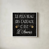 Inspirational Collage I French on Black by Daphne Brissonnet. Shown in a crisp white glass frame for a clean and minimalist style. Available as an archival giclee rolled canvas, fine art paper, or poster print. SKU 28847a.
