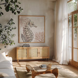 Ocean Finds XII Neutral by Daphne Brissonnet. Shown in a natural wood frame in a cozy modern living room. Available as an archival giclee rolled canvas, fine art paper, or poster print. SKU 85800a.
