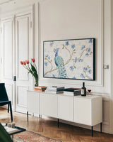 Peacock Allegory I White by Daphne Brissonnet. shown as a framed stretched canvas in a living room above a console. Available as a archival giclee rolled canvas, fine art paper, or poster print. SKU 37508i.