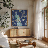 Peacock Allegory III Blue by Daphne Brissonnet. Shown in a natural wood frame in a cozy modern living room. Available as an archival giclee rolled canvas, fine art paper, or poster print. SKU 37506a.