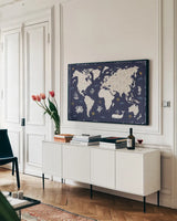 Primitive Sea II Dark by Daphne Brissonnet. shown as a framed stretched canvas in a living room above a console. Available as a archival giclee rolled canvas, fine art paper, or poster print. SKU 63863i.