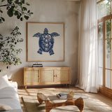 Primitive Sea III Navy by Daphne Brissonnet. Shown in a natural wood frame in a cozy modern living room. Available as an archival giclee rolled canvas, fine art paper, or poster print. SKU 65665a.