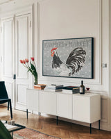 Roosters Call I by Daphne Brissonnet. shown as a framed stretched canvas in a living room above a console. Available as a archival giclee rolled canvas, fine art paper, or poster print. SKU 37487i.