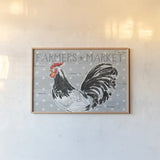 Roosters Call I by Daphne Brissonnet. shown as a paper print in a natural frame. Available as a archival giclee rolled canvas, fine art paper, or poster print. SKU 37487i.
