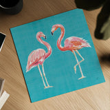 Tropical Oasis Pink Flamingos by Daphne Brissonnet. Shown as a detailed flat fine art print, highlighting archival giclee quality. Available as an archival giclee rolled canvas, fine art paper, or poster print. SKU 34976a.
