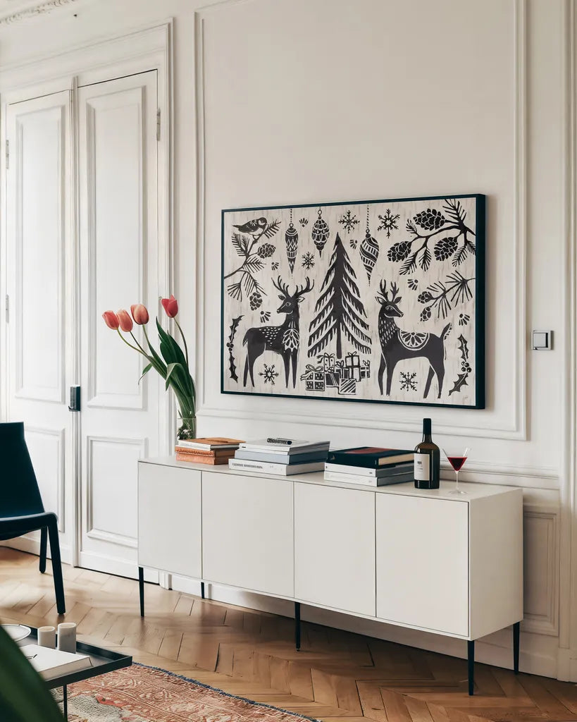 Woodcut Christmas I by Daphne Brissonnet. shown as a framed stretched canvas in a living room above a console. Available as a archival giclee rolled canvas, fine art paper, or poster print. SKU 69680i.
