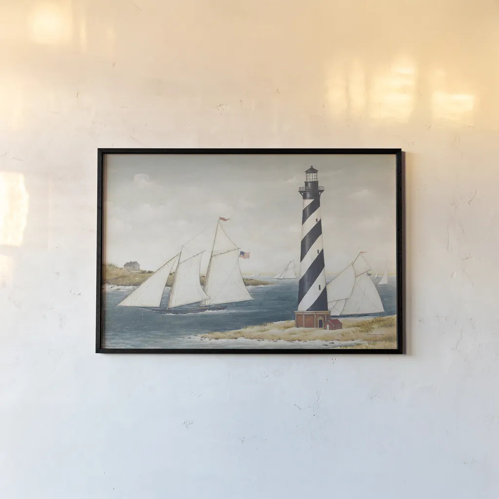 Hatteras Light by David Carter Brown. shown as a paper print in a black flame. Available as a archival giclee rolled canvas, fine art paper, or poster print. SKU 37654i.