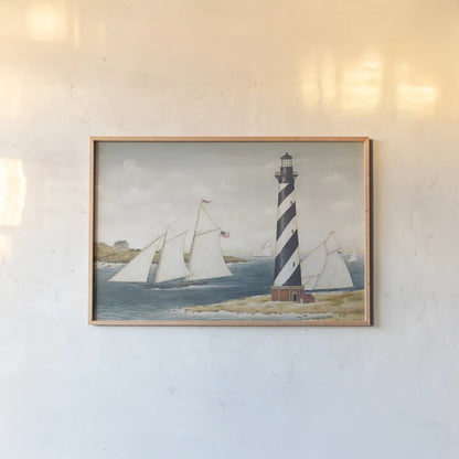 Hatteras Light by David Carter Brown. shown as a paper print in a natural frame. Available as a archival giclee rolled canvas, fine art paper, or poster print. SKU 37654i.