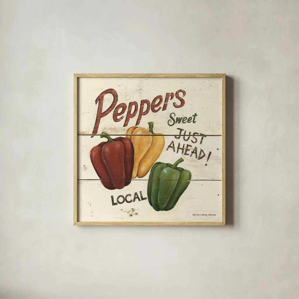 Sweet Peppers by David Carter Brown. Shown in a natural wood glass frame for a timeless modern aesthetic. Available as an archival giclee rolled canvas, fine art paper, or poster print. SKU 3191a.