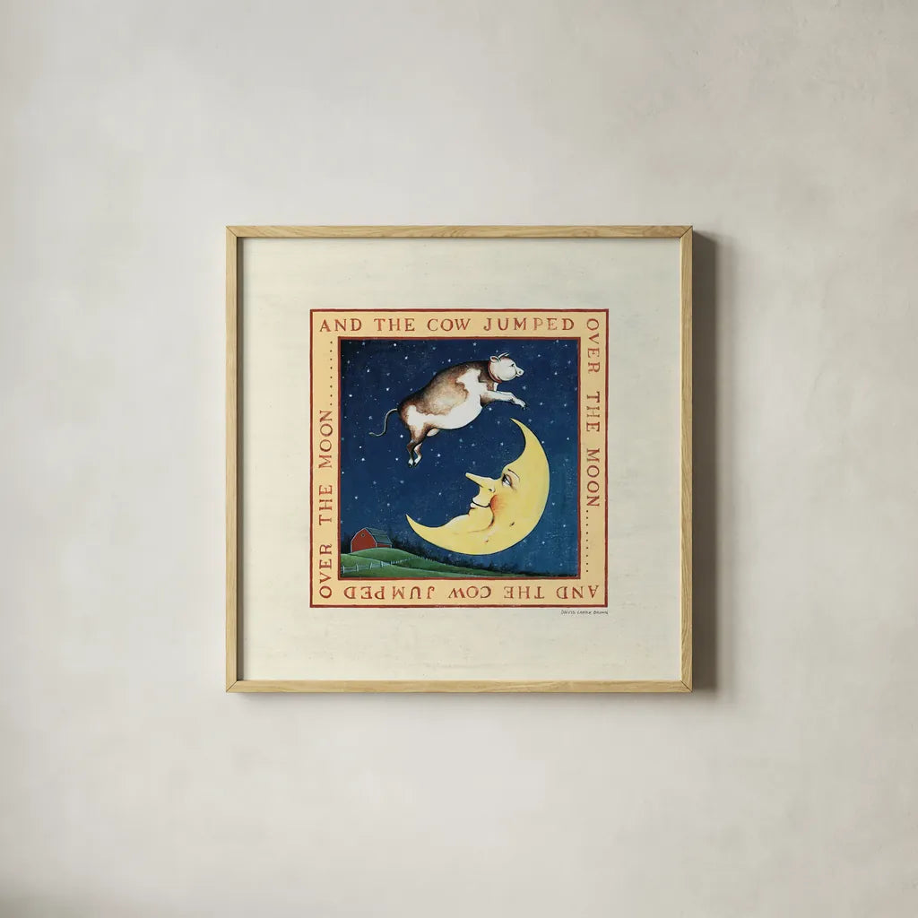 The Cow Jumped by David Carter Brown. Shown in a natural wood glass frame for a timeless modern aesthetic. Available as an archival giclee rolled canvas, fine art paper, or poster print. SKU 3153a.