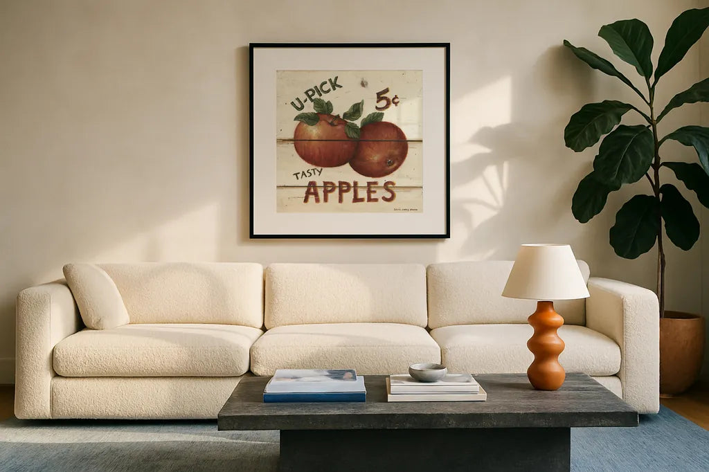 U-Pick Apples by David Carter Brown. Displayed in a glass frame with matte in a clean modern living room. Available as an archival giclee rolled canvas, fine art paper, or poster print. SKU 3182a.