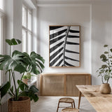BW Fern IV by Deborah Revell. shown as a print in a natural wood frame in a dining room. Available as a archival giclee rolled canvas, fine art paper, or poster print. SKU 92035h.