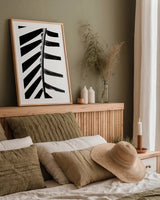 BW Fern IV by Deborah Revell. shown as a paper print in a natural frame. Available as a archival giclee rolled canvas, fine art paper, or poster print. SKU 92035h.