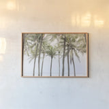 Beach Palms by Deborah Revell. shown as a paper print in a natural frame. Available as a archival giclee rolled canvas, fine art paper, or poster print. SKU 104902i.