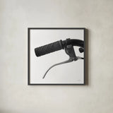 Bike Detail I by Deborah Revell. Shown in a sleek black glass frame for a contemporary gallery look. Available as an archival giclee rolled canvas, fine art paper, or poster print. SKU 104369a.