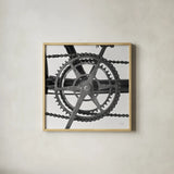 Bike Detail II by Deborah Revell. Shown in a natural wood glass frame for a timeless modern aesthetic. Available as an archival giclee rolled canvas, fine art paper, or poster print. SKU 104370a.