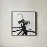 Bike Detail IV by Deborah Revell. Shown in a sleek black glass frame for a contemporary gallery look. Available as an archival giclee rolled canvas, fine art paper, or poster print. SKU 104372a.