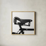 Bike Detail V by Deborah Revell. Shown in a natural wood glass frame for a timeless modern aesthetic. Available as an archival giclee rolled canvas, fine art paper, or poster print. SKU 104373a.