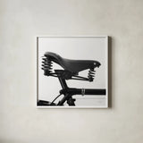 Bike Detail V by Deborah Revell. Shown in a crisp white glass frame for a clean and minimalist style. Available as an archival giclee rolled canvas, fine art paper, or poster print. SKU 104373a.