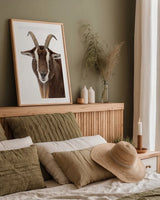 Billy the Goat by Deborah Revell. shown as a paper print in a natural frame. Available as a archival giclee rolled canvas, fine art paper, or poster print. SKU 96327h.