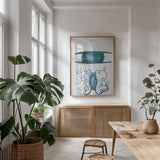 Blue Bay VI by Deborah Revell. shown as a print in a natural wood frame in a dining room. Available as a archival giclee rolled canvas, fine art paper, or poster print. SKU 91281h.