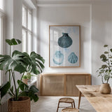 Blue Bay VII by Deborah Revell. shown as a print in a natural wood frame in a dining room. Available as a archival giclee rolled canvas, fine art paper, or poster print. SKU 91282h.