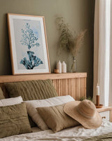 Blue Bay VIII by Deborah Revell. shown as a paper print in a natural frame. Available as a archival giclee rolled canvas, fine art paper, or poster print. SKU 91283h.