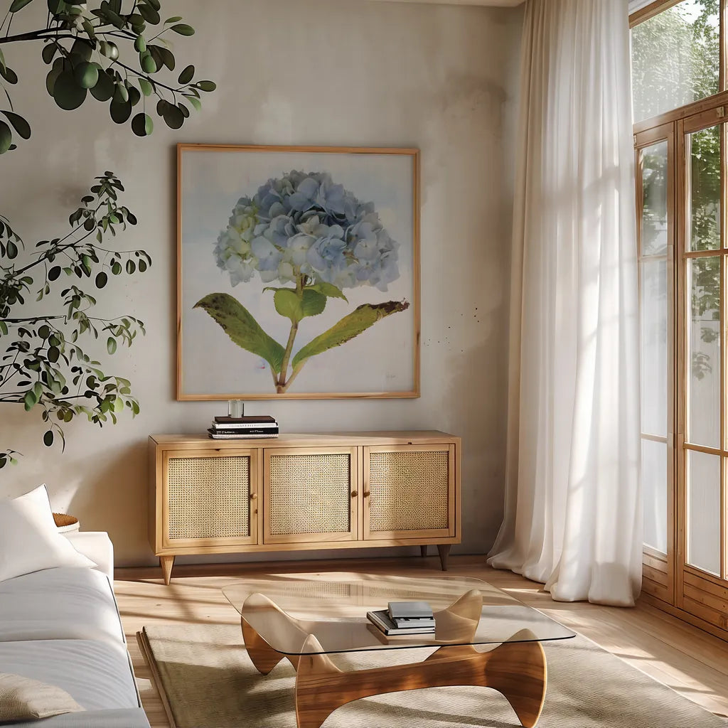 Blue Hydrangea by Deborah Revell. Shown in a natural wood frame in a cozy modern living room. Available as an archival giclee rolled canvas, fine art paper, or poster print. SKU 91227a.