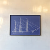 Blue Schooner I by Deborah Revell. shown as a paper print in a black flame. Available as a archival giclee rolled canvas, fine art paper, or poster print. SKU 104263i.