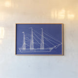 Blue Schooner I by Deborah Revell. shown as a paper print in a natural frame. Available as a archival giclee rolled canvas, fine art paper, or poster print. SKU 104263i.