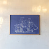 Blue Schooner II by Deborah Revell. shown as a paper print in a natural frame. Available as a archival giclee rolled canvas, fine art paper, or poster print. SKU 104264i.