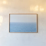 Blue Sea by Deborah Revell. shown as a paper print in a natural frame. Available as a archival giclee rolled canvas, fine art paper, or poster print. SKU 103791i.